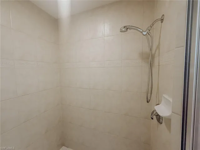 Bathroom with a tile shower