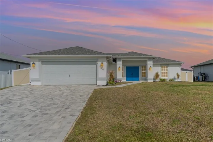 View of front of property featuring a garage