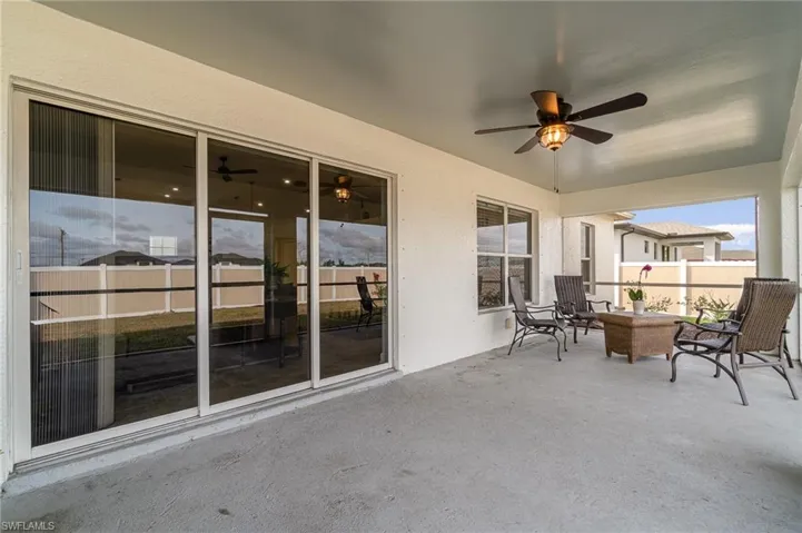 View of patio featuring ceiling fan