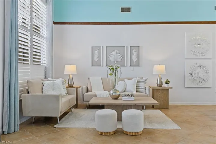 Living room with light tile patterned floors