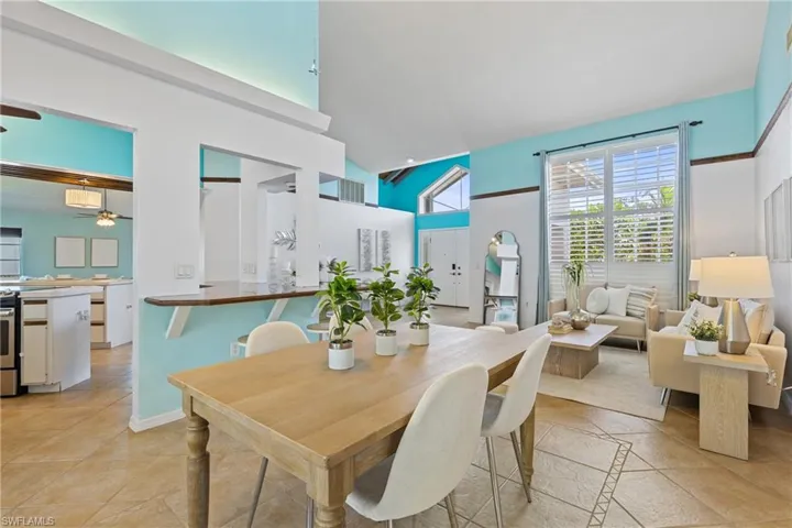 Tiled dining area with a high ceiling