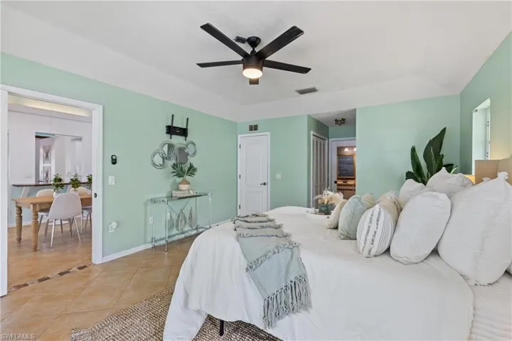 Bedroom featuring ceiling fan and light tile patterned flooring
