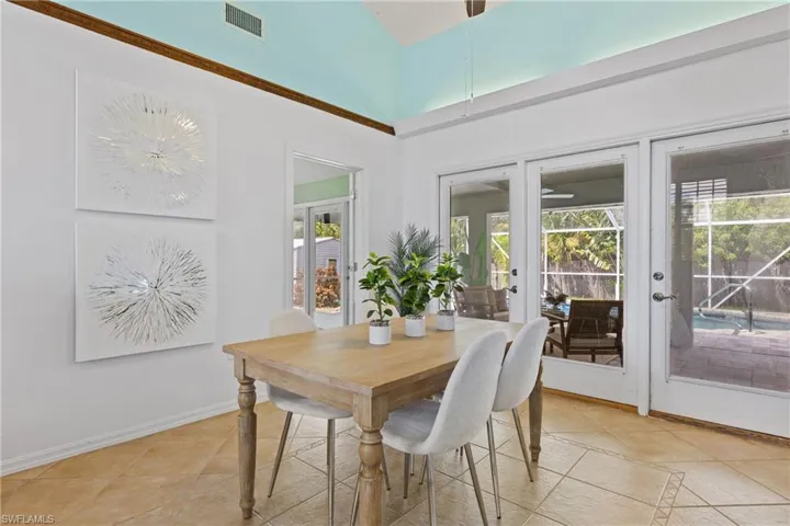 Tiled dining space with french doors