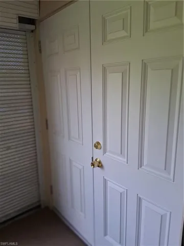 Laundry in lanai with awesome storage doors