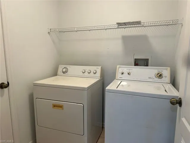 Laundry room featuring independent washer and dryer