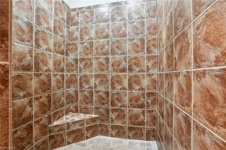 Bathroom featuring a tile shower