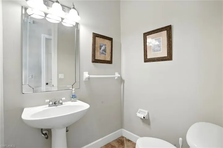 Bathroom featuring toilet and tile patterned flooring