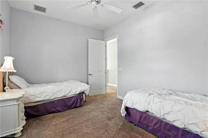 Bedroom with carpet flooring and ceiling fan