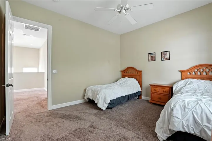 Bedroom featuring carpet floors and ceiling fan