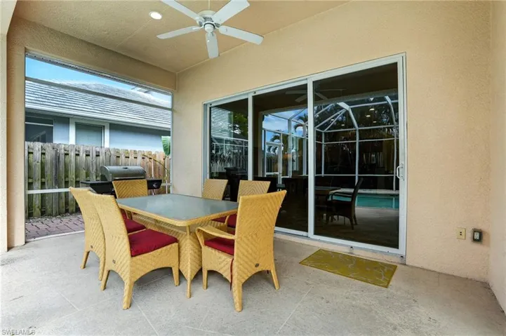 View of patio / terrace with ceiling fan, outdoor dining space, and a grill