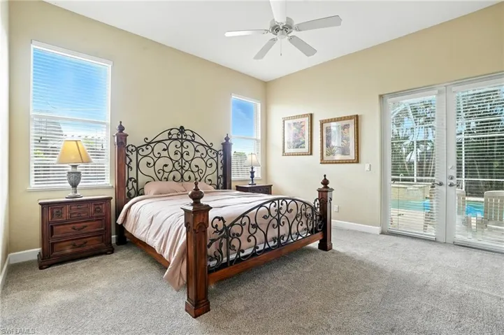Bedroom with carpet floors, access to outside, and ceiling fan