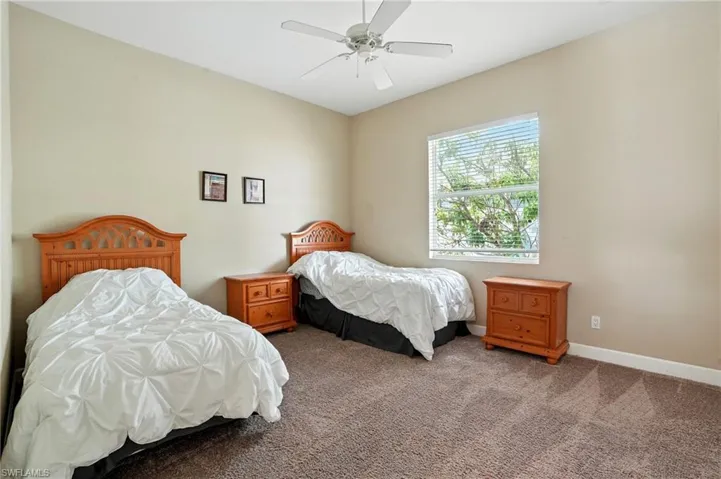 Bedroom featuring carpet floors and a ceiling fan