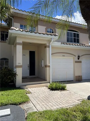 Mediterranean / spanish-style house featuring driveway, stucco siding, and an attached garage