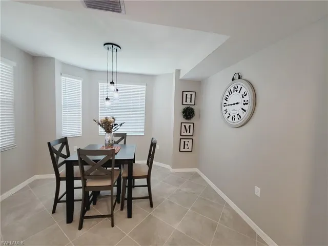 Dining area featuring light tile patterned floors