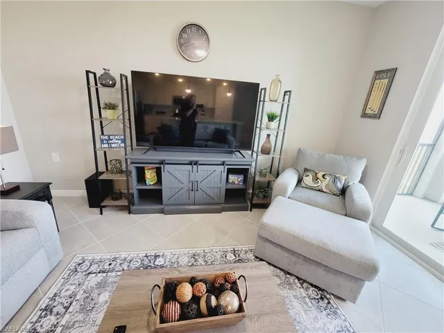 Living room featuring tile patterned floors