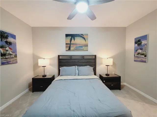 Bedroom featuring ceiling fan and light colored carpet