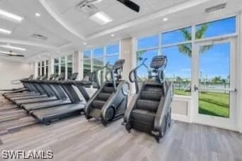 Exercise room featuring hardwood / wood-style flooring