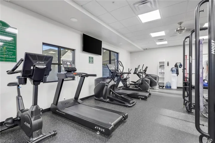 Workout area with a paneled ceiling