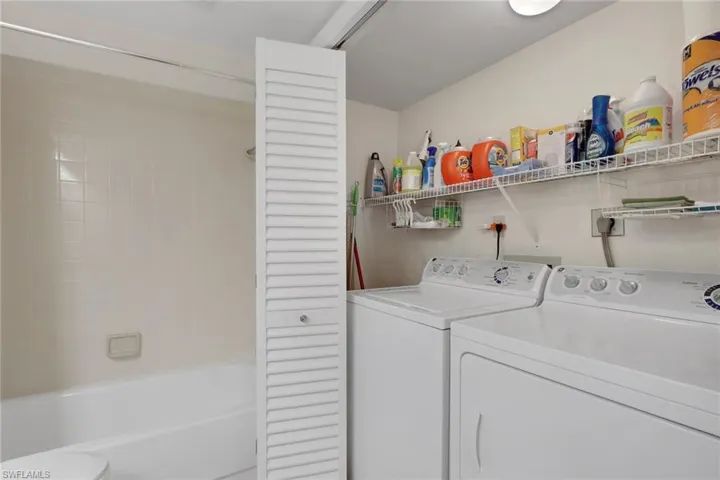 Laundry room featuring washer and clothes dryer
