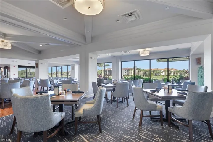 Dining area with ornamental molding, beamed ceiling, and recessed lighting