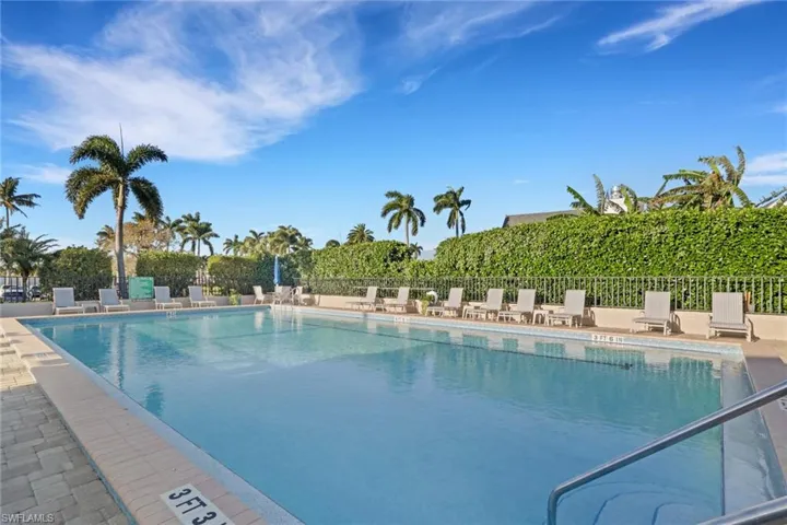 Community pool with a patio area
