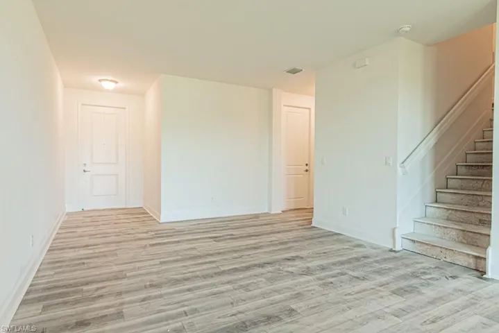 Spare room with light wood-type flooring