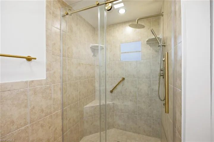 Owner's bathroom with modern glass enclosure