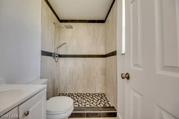 Full bath featuring vanity and a stall shower