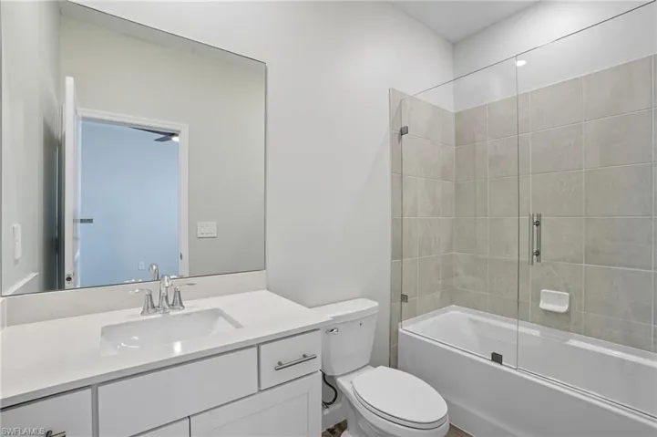 Bathroom with shower / bathtub combination and vanity