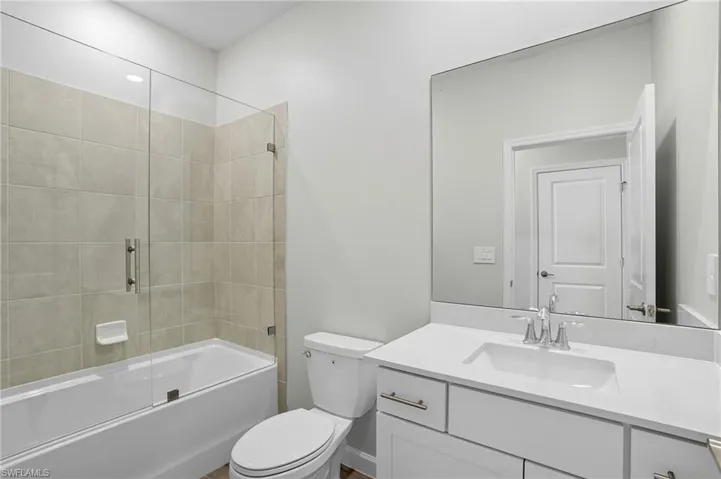 Bathroom featuring bathing tub / shower combination and vanity