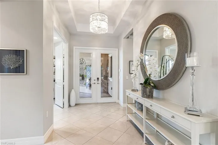 Large open foyer area, with view to back lanai and pool