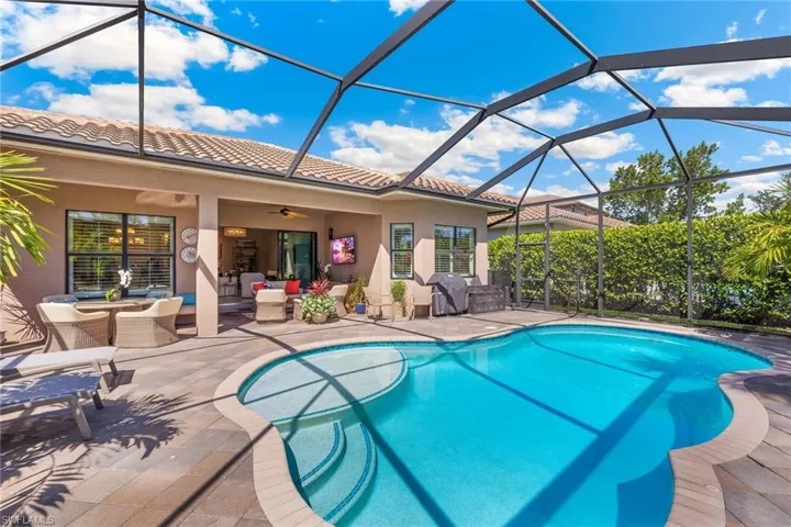 Heated pool with sunshelf to soak up the Naples sun.