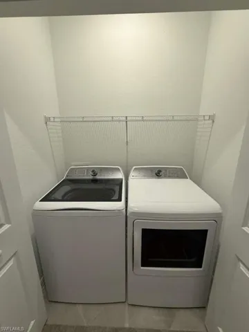 Laundry area featuring separate washer and dryer