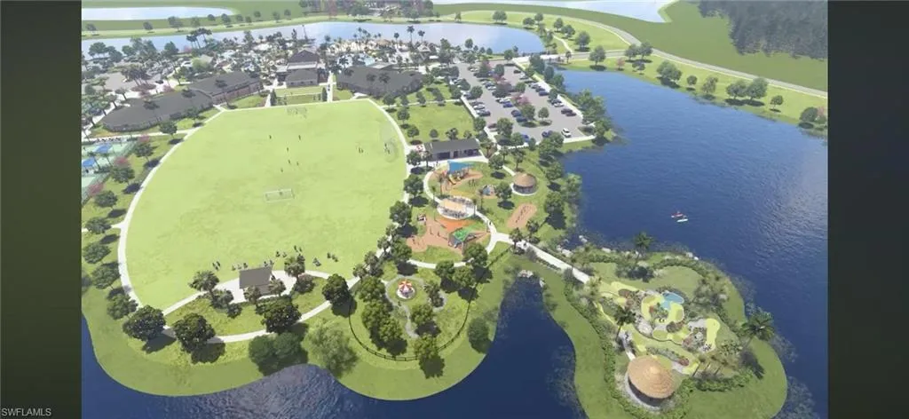 Aerial view of property's location featuring a large body of water