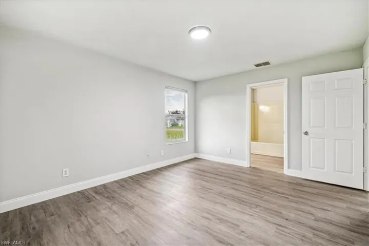 Unfurnished room featuring hardwood / wood-style flooring