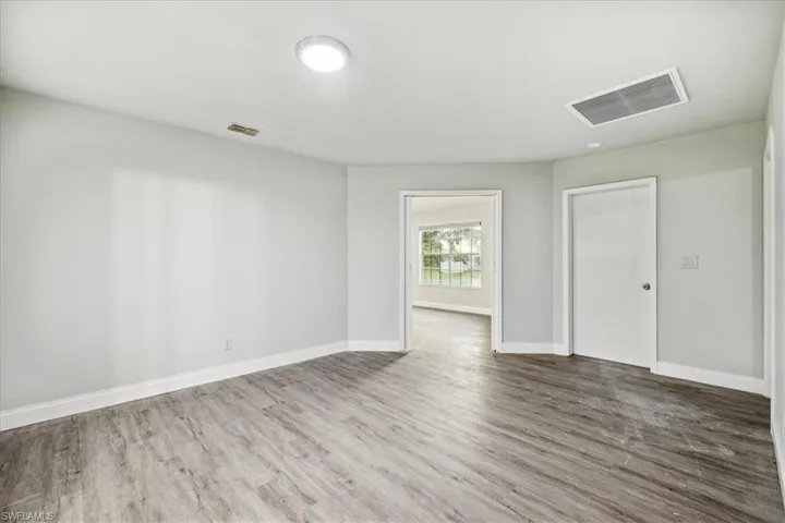 Empty room featuring hardwood / wood-style floors