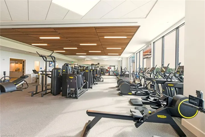 Workout area featuring floor to ceiling windows