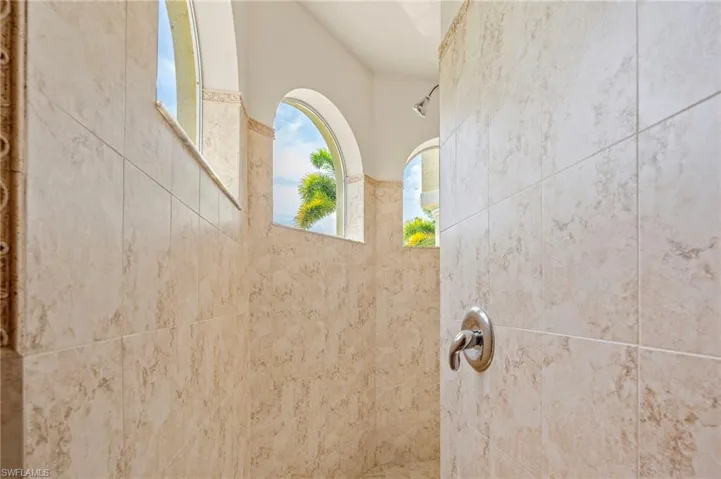 Bathroom view of a tile shower