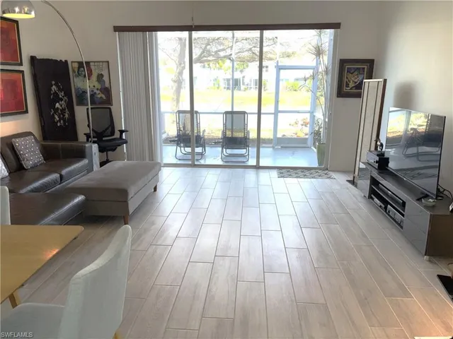 Living room with wood tiled floors and healthy amount of natural light