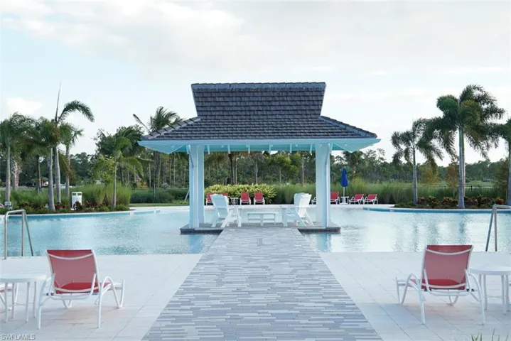 View of swimming pool featuring a gazebo and a patio