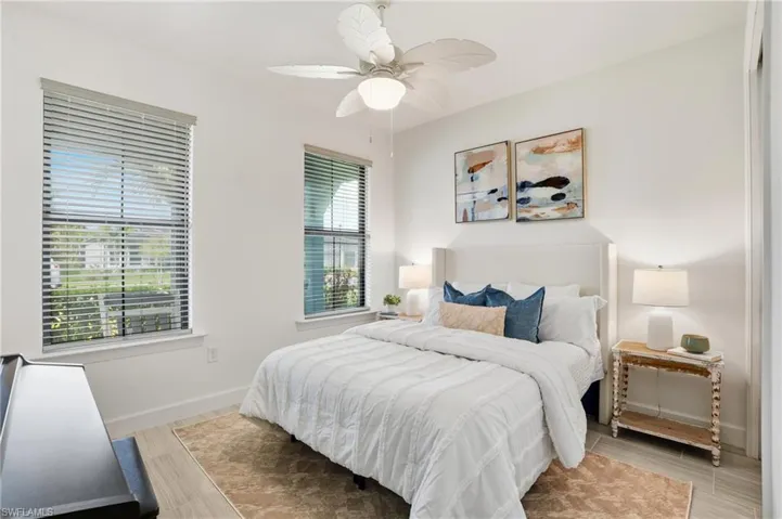 Bedroom featuring light wood-type flooring and a ceiling fan