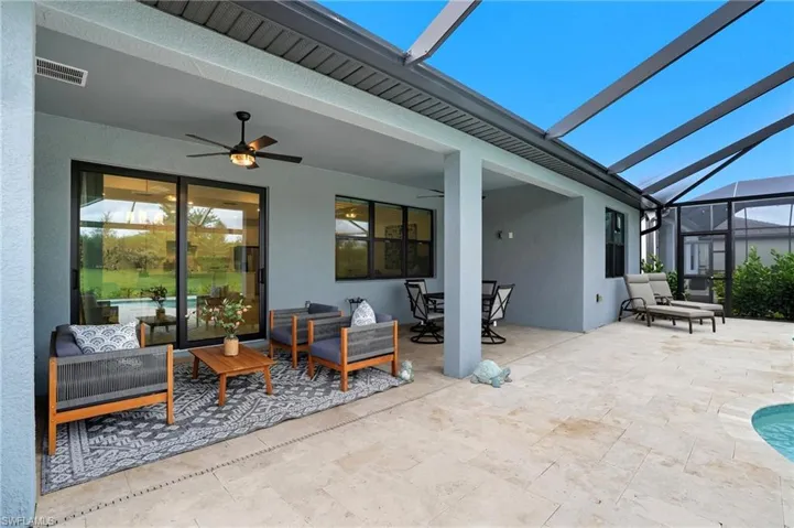 View of patio / terrace with a sunroom, outdoor lounge area, glass enclosure, and outdoor dining space