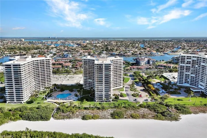 View of urban area featuring a nearby body of water and apartment complex