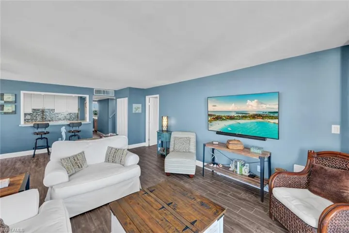Living room with wood finish floors and baseboards