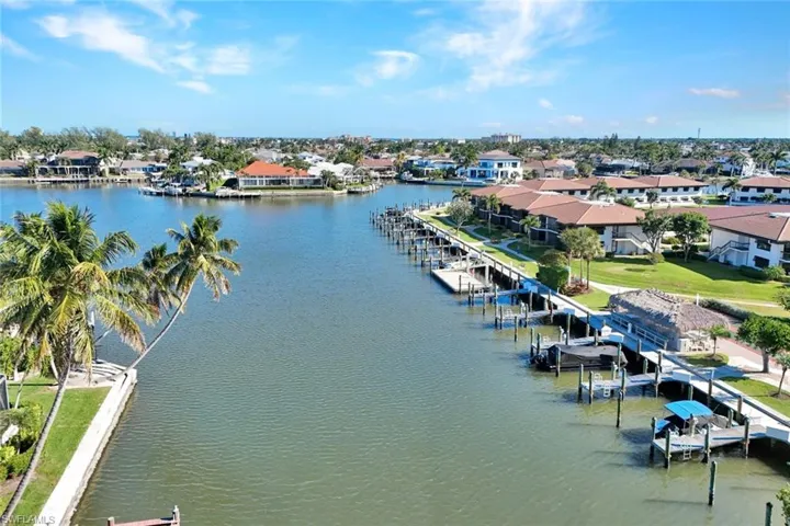 Aerial perspective of suburban area with a large body of water