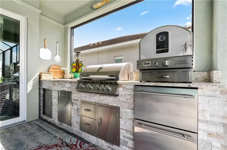 View of patio with an outdoor kitchen