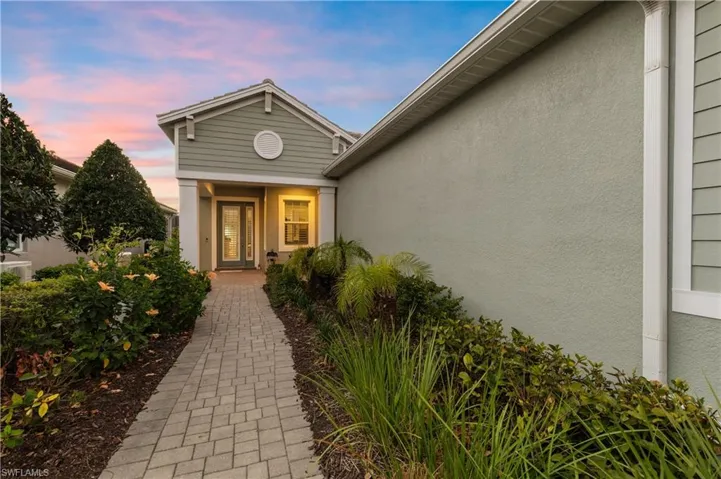 View of exterior entry with stucco siding