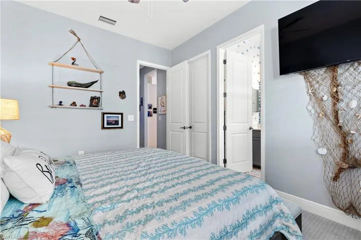 Bedroom featuring a ceiling fan and baseboards