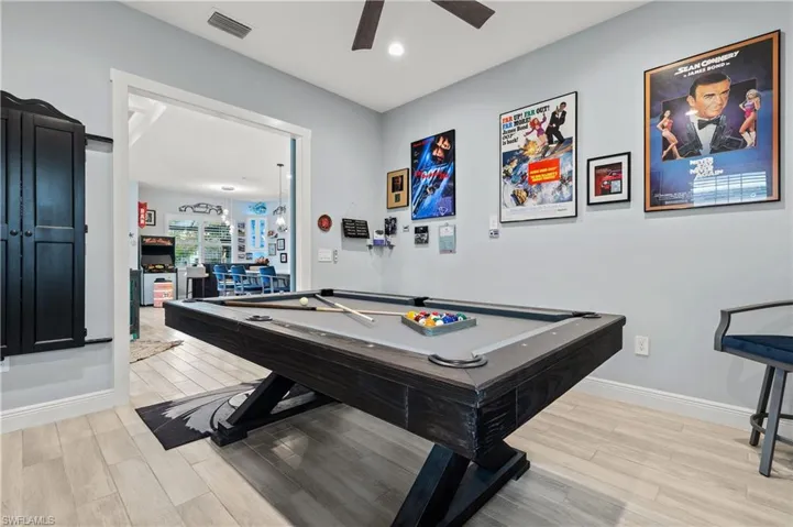 Game room with billiards, wood tiled floors, ceiling fan, and recessed lighting