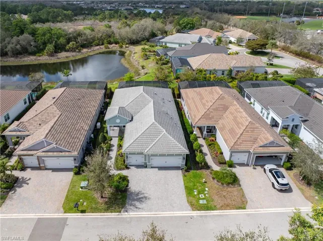Aerial perspective of suburban area with a large body of water